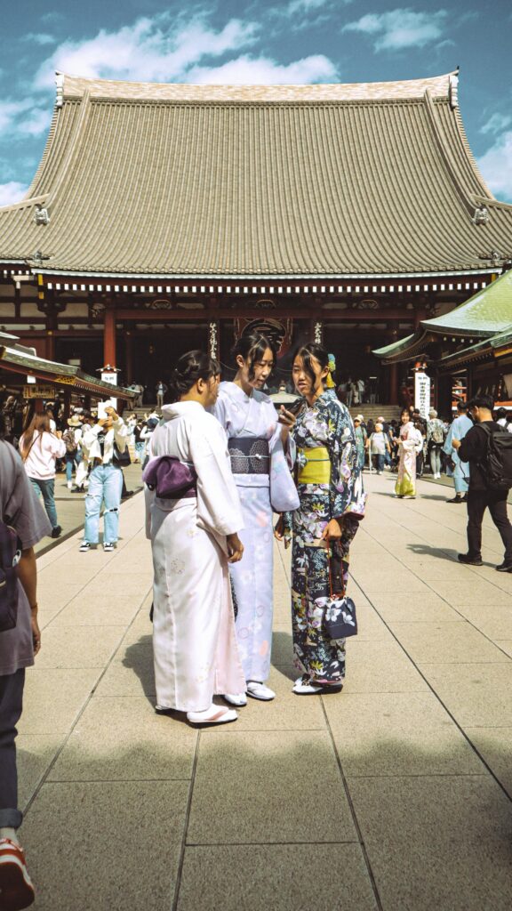 Women in traditional kimono gather at the historic Senso-ji Temple in Tokyo, Japan.