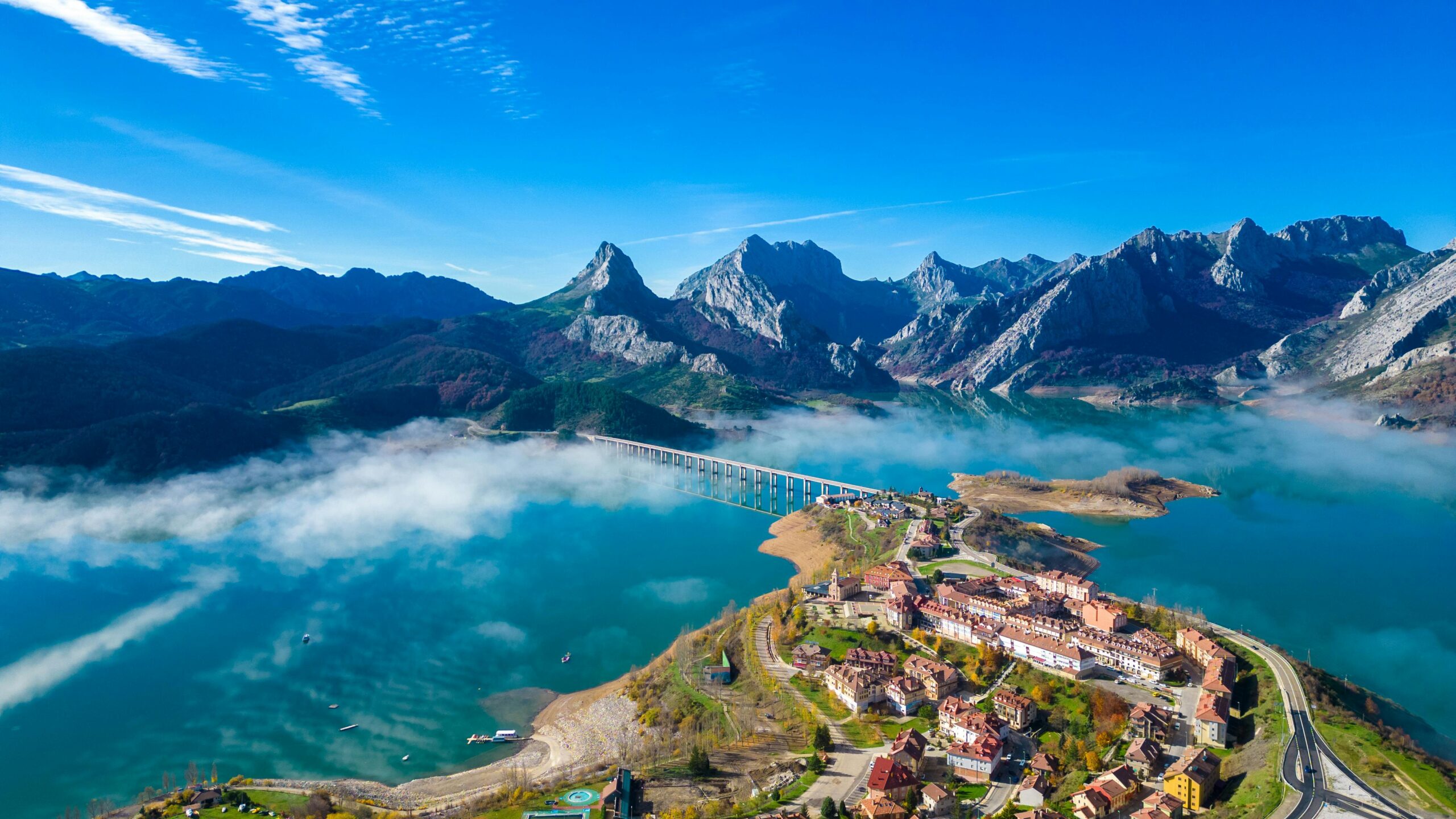 Stunning aerial shot of Riaño Lake and mountains in Castilla y León, Spain.