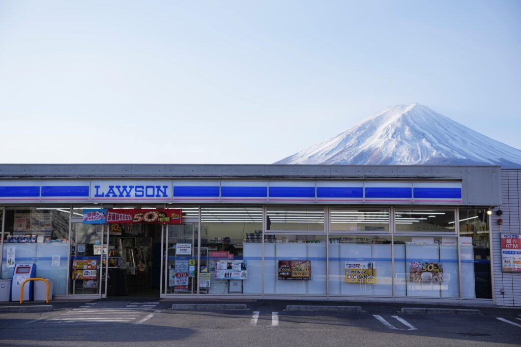 Lawson convenience store with Mount Fuji backdrop in Yamanashi, Japan, capturing serene rural lifestyle.