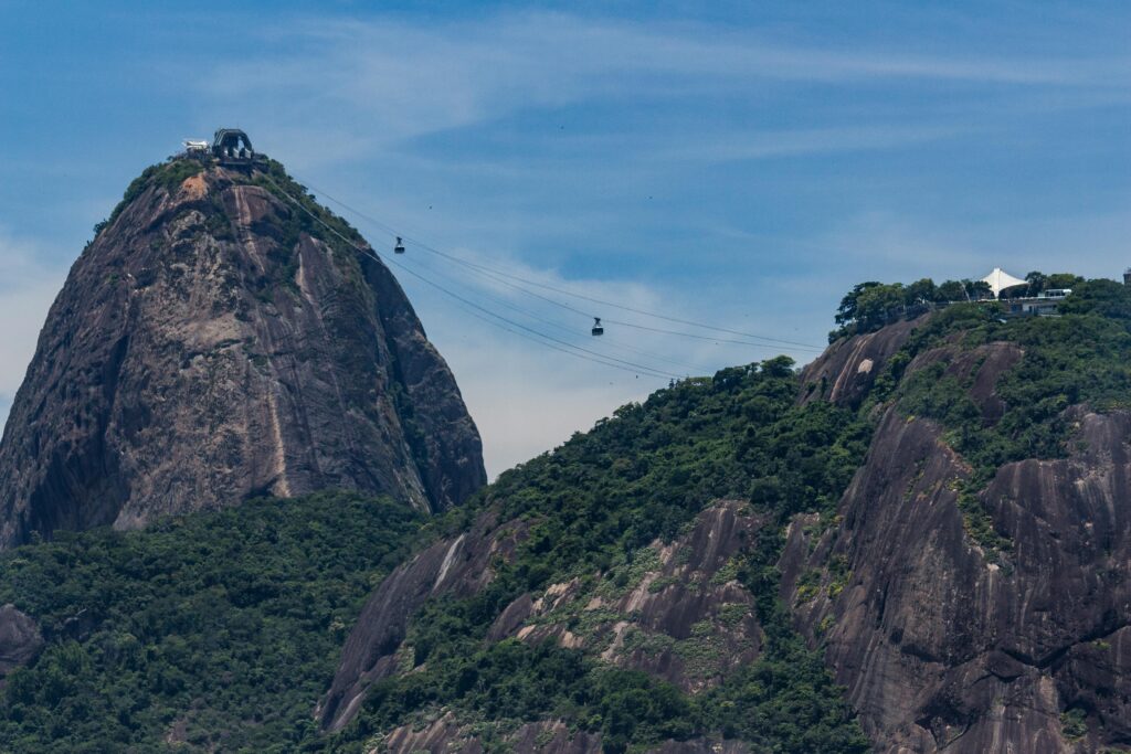 View of cable cars traveling up the iconic Sugarloaf Mountain in Rio de Janeiro, Brazil.
