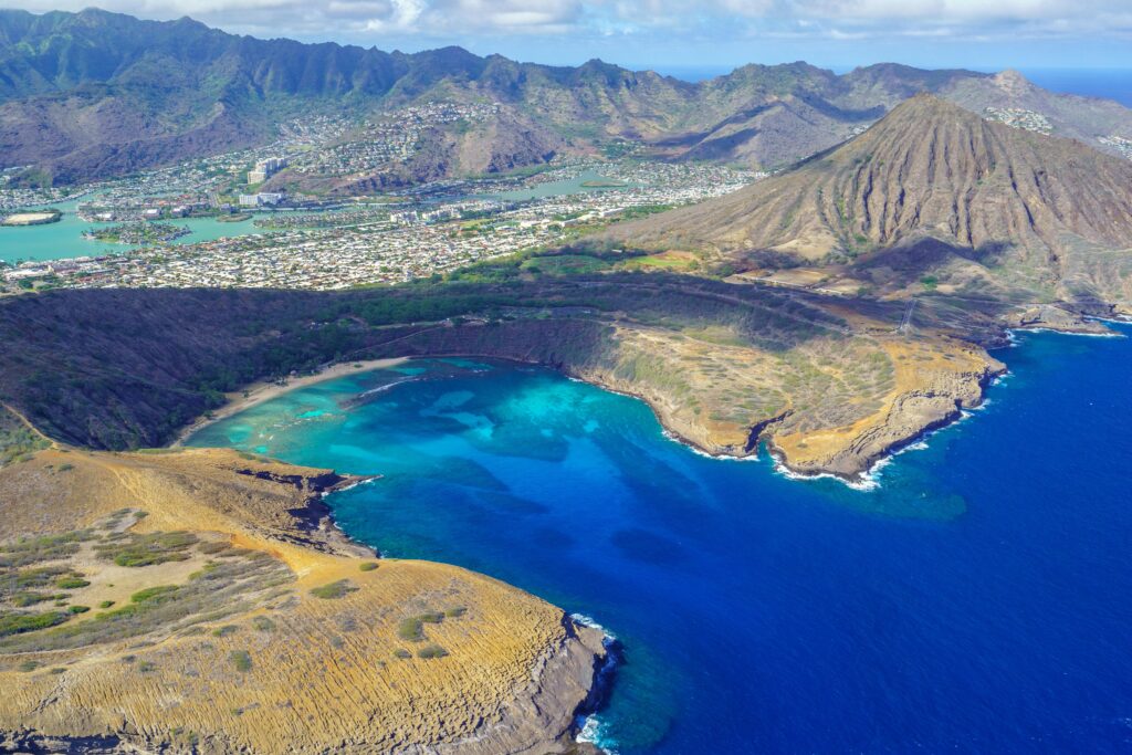 Stunning aerial view of Hanauma Bay with turquoise waters and volcanic landscapes in Oahu, Hawaii.