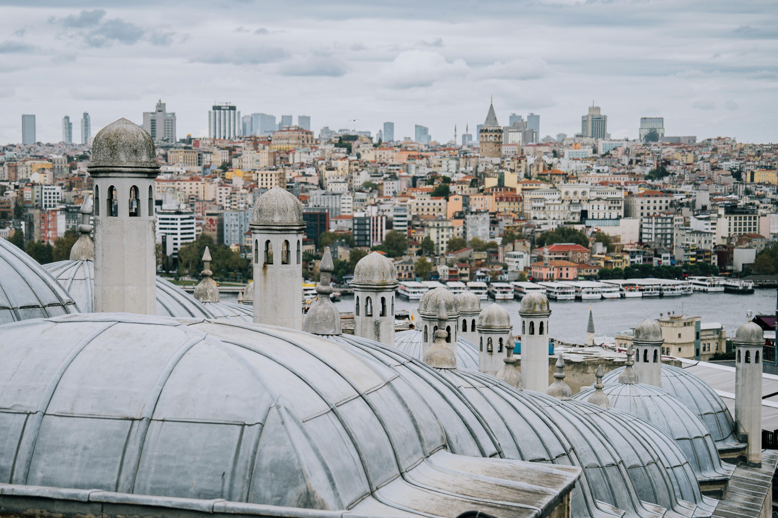 Roofscape with Galata Tower in Istanbul overlooking the urban skyline and Bosphorus.