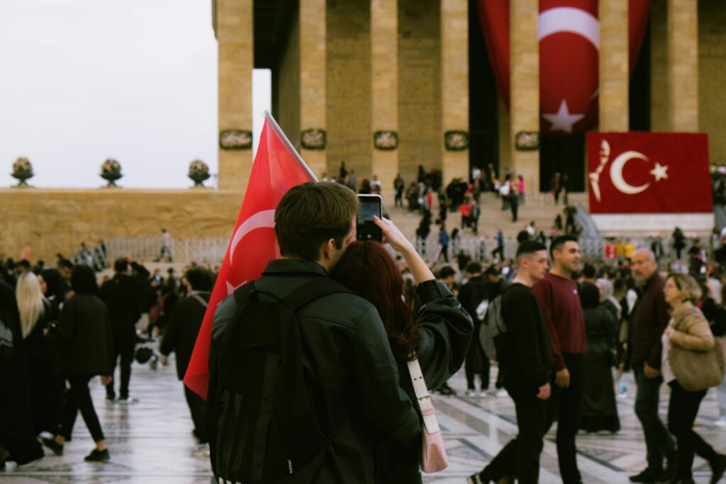 Crowd at Anıtkabir in Ankara, showcasing Turkish flags and patriotism.