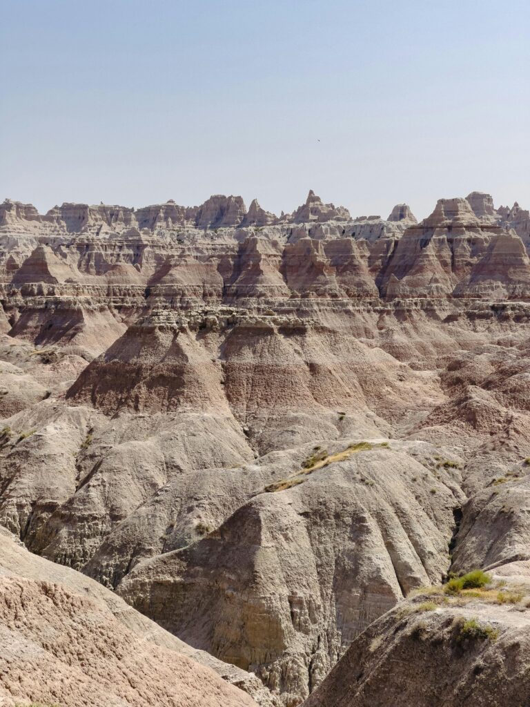 Explore the dramatic eroded rock formations in Badlands National Park, SD, USA.