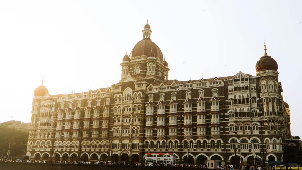 Beautiful view of the iconic Taj Mahal Palace Hotel in Mumbai during a serene sunrise.