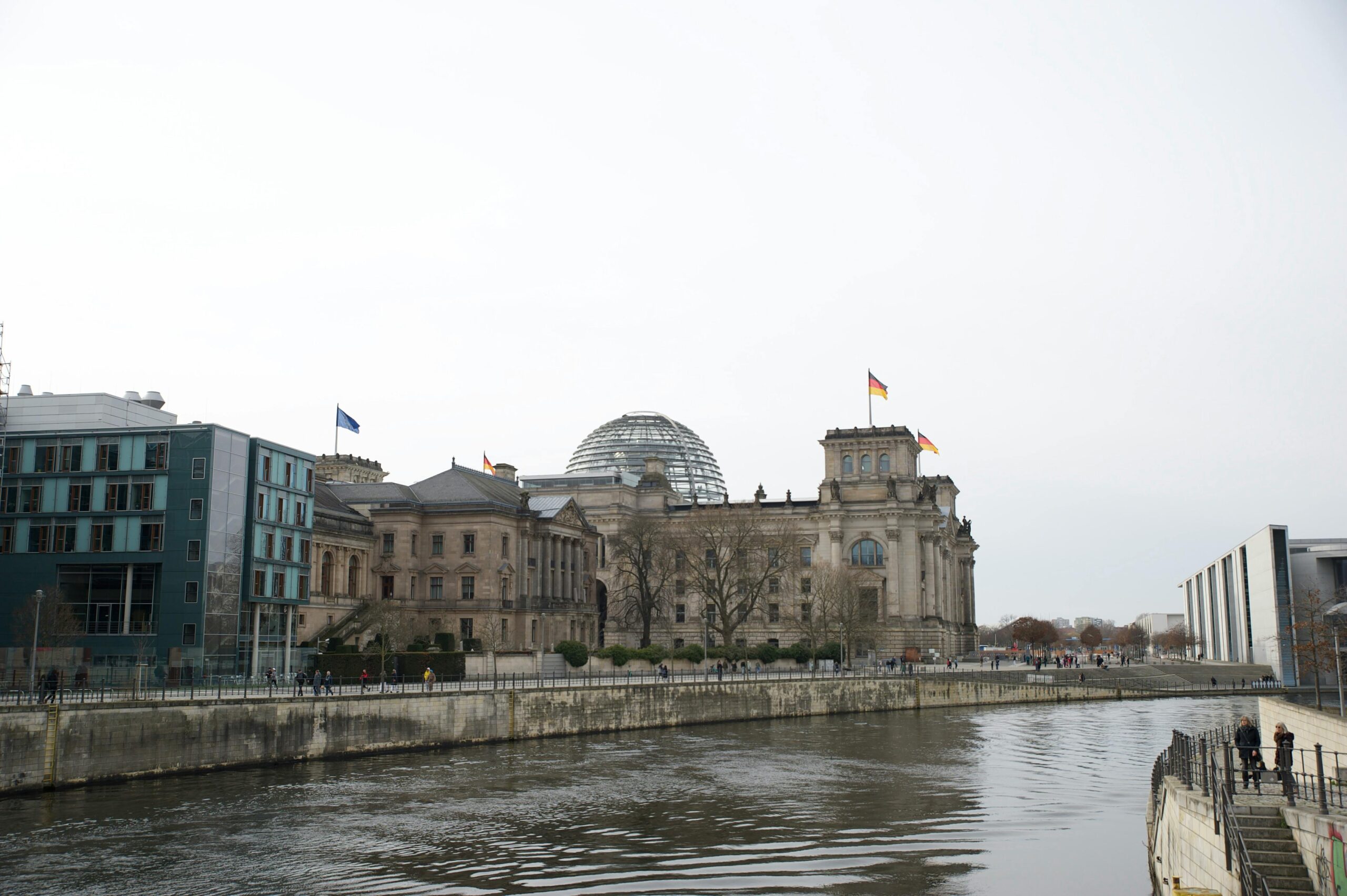 View of the historic Reichstag Building in Berlin, Germany, along a river