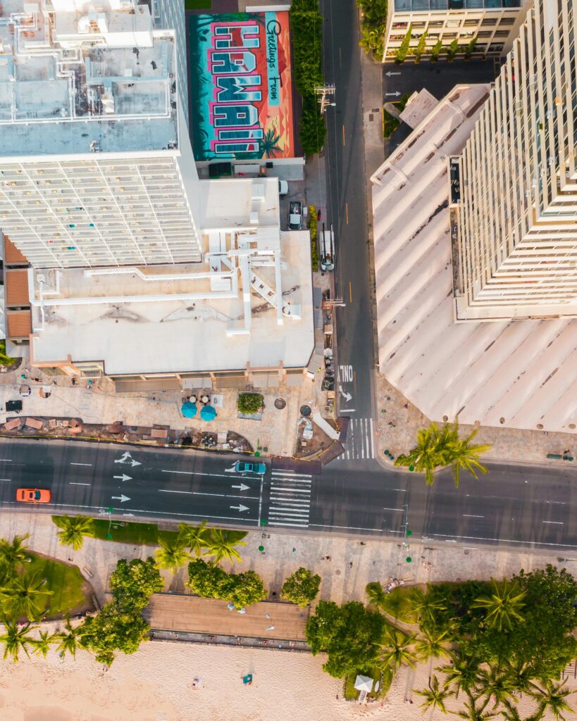 Stunning aerial view of urban Waikiki, Hawaii with vibrant street and buildings.