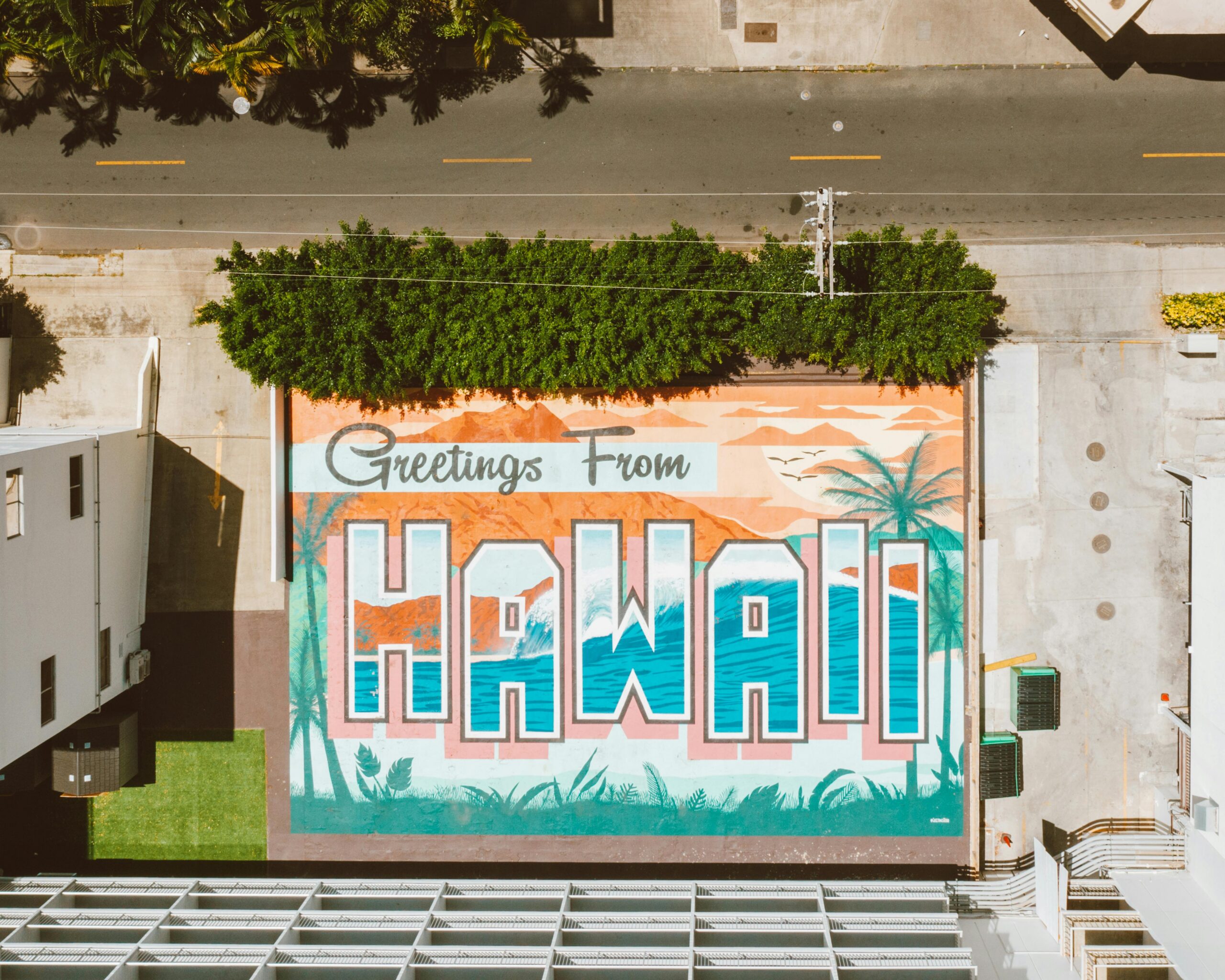 Vibrant aerial mural of Hawaii on street with palm trees. Ideal for travel inspiration.