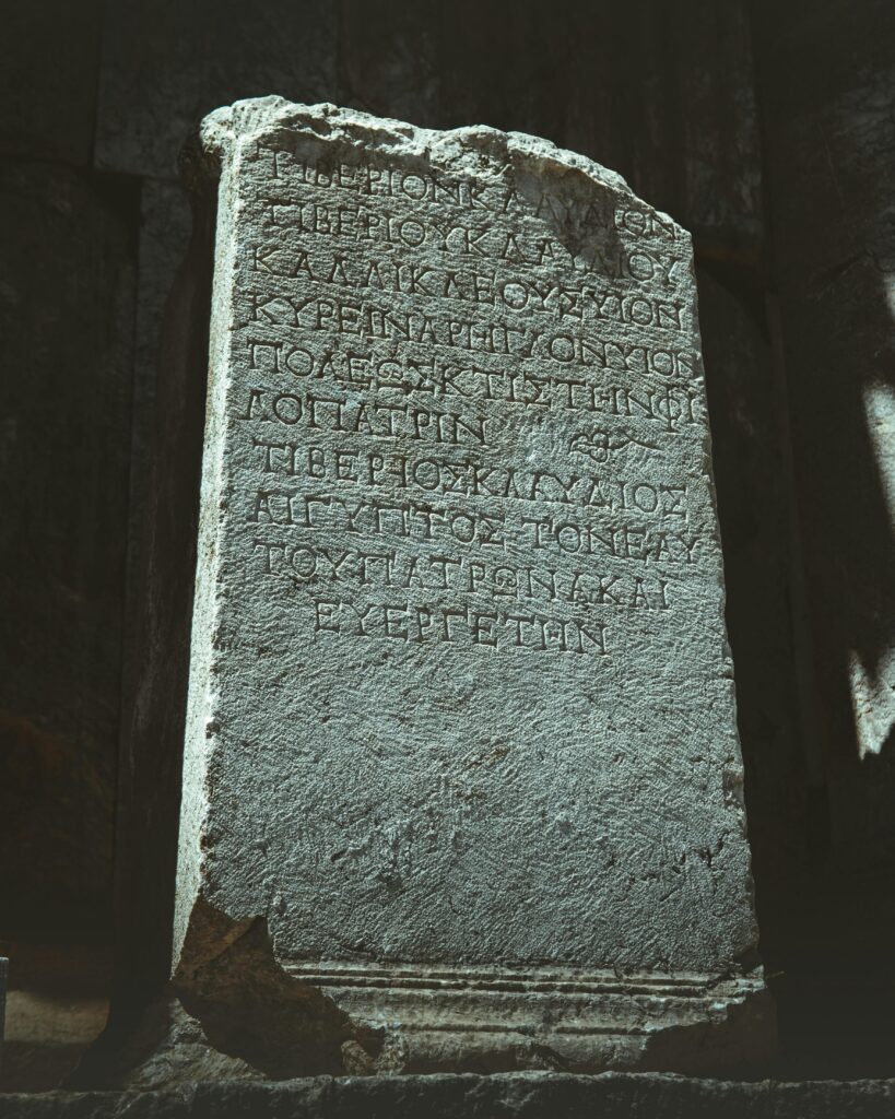 Historic carved stone with ancient inscriptions in Burdur, Türkiye, showcasing past civilizations.