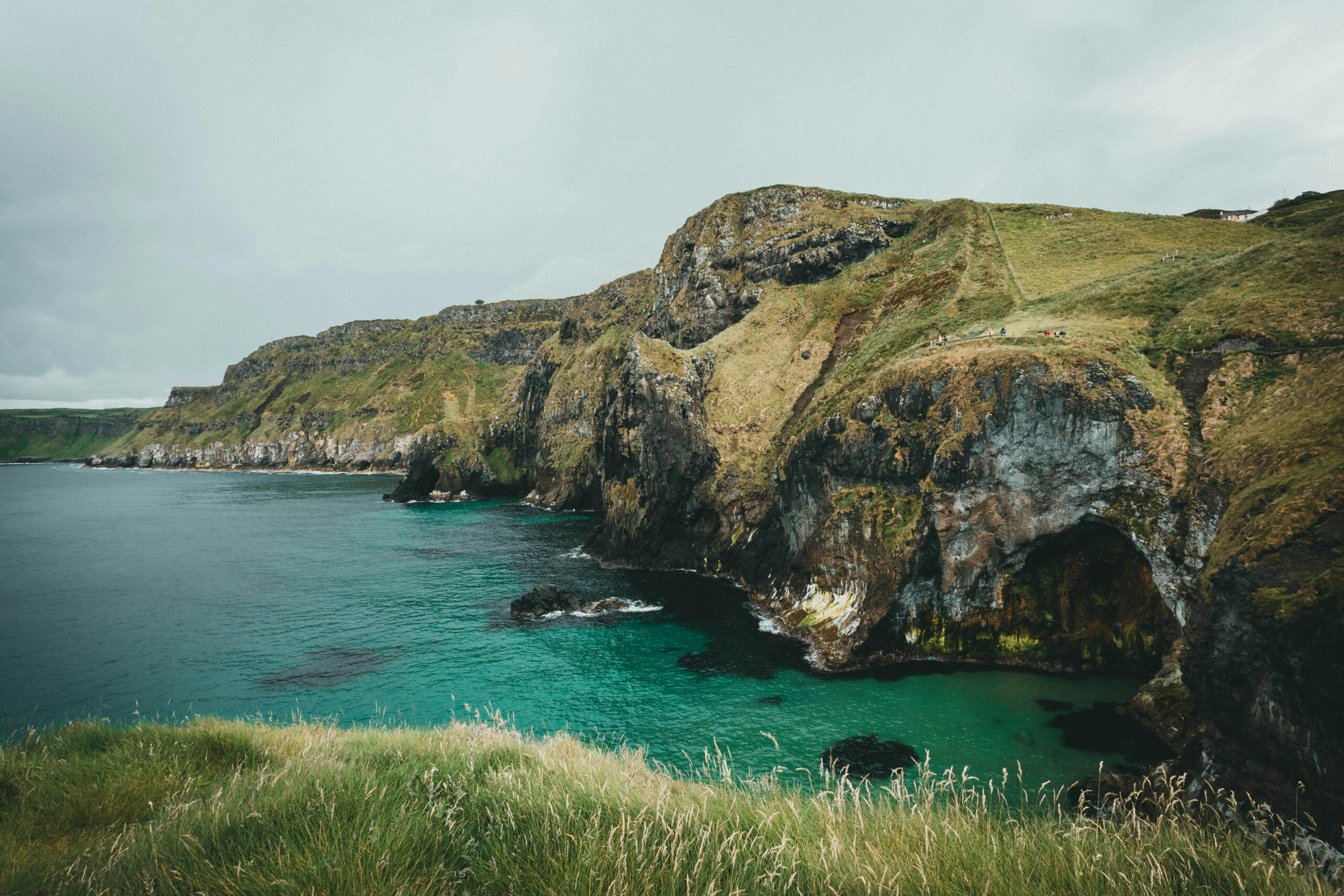 Stunning coastal cliffs with turquoise waters, showcasing natural beauty and scenic views.