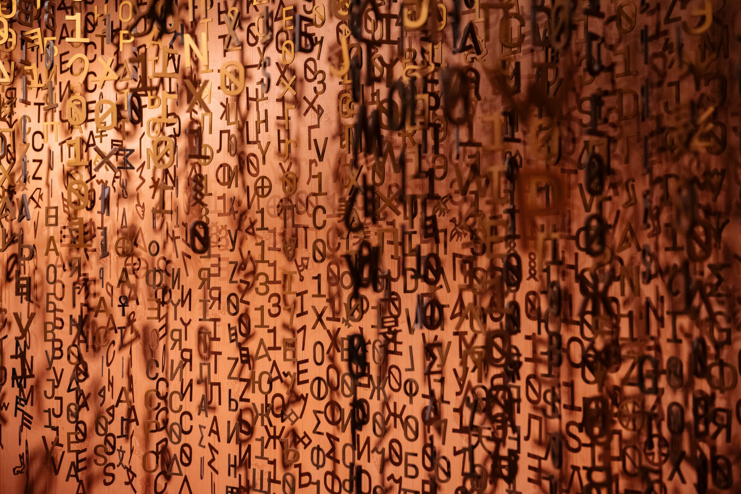 Abstract display of floating letters creating a creative visual texture.