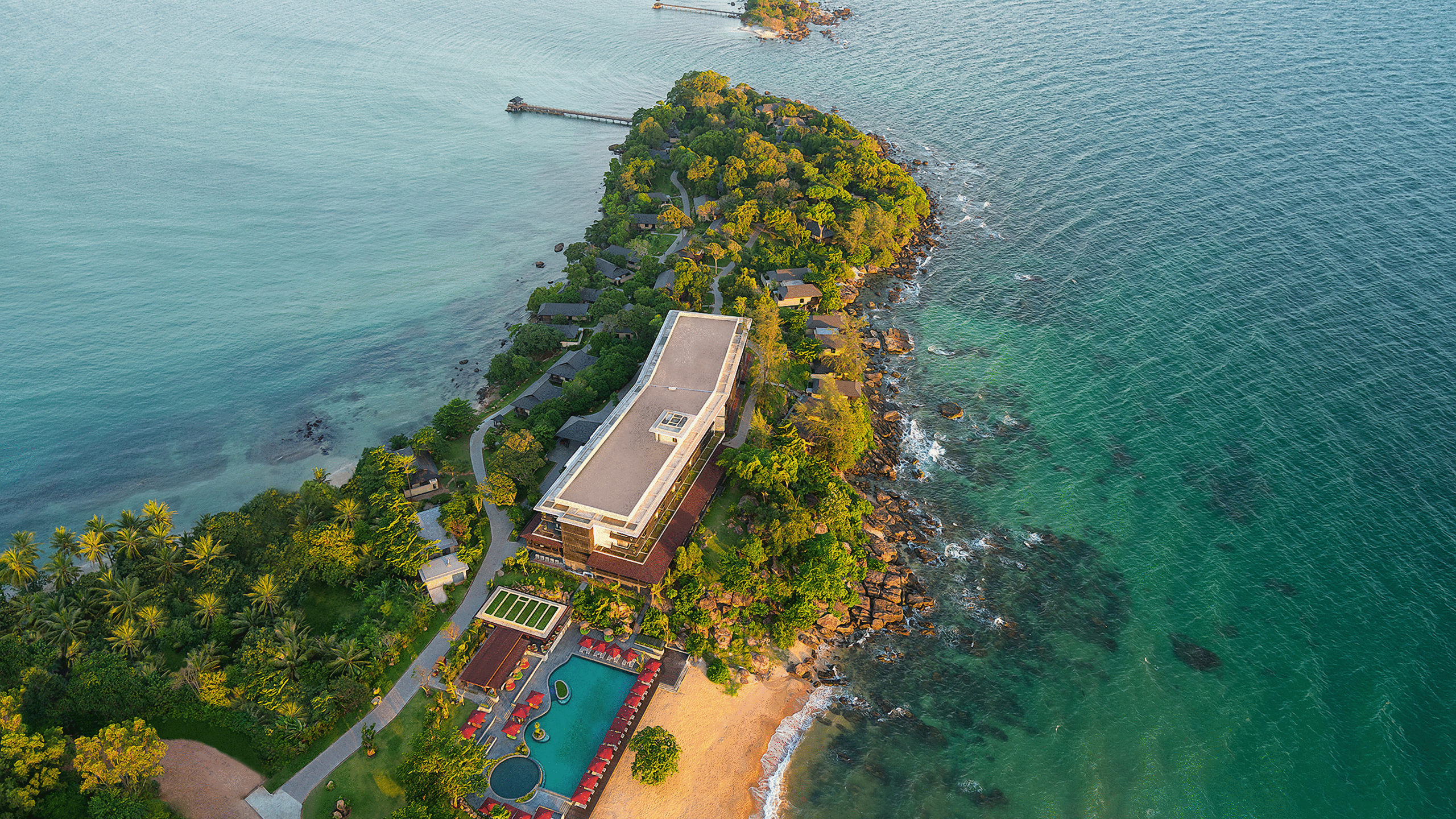 Breathtaking aerial shot of a tropical island with resort and ocean view in Vietnam.