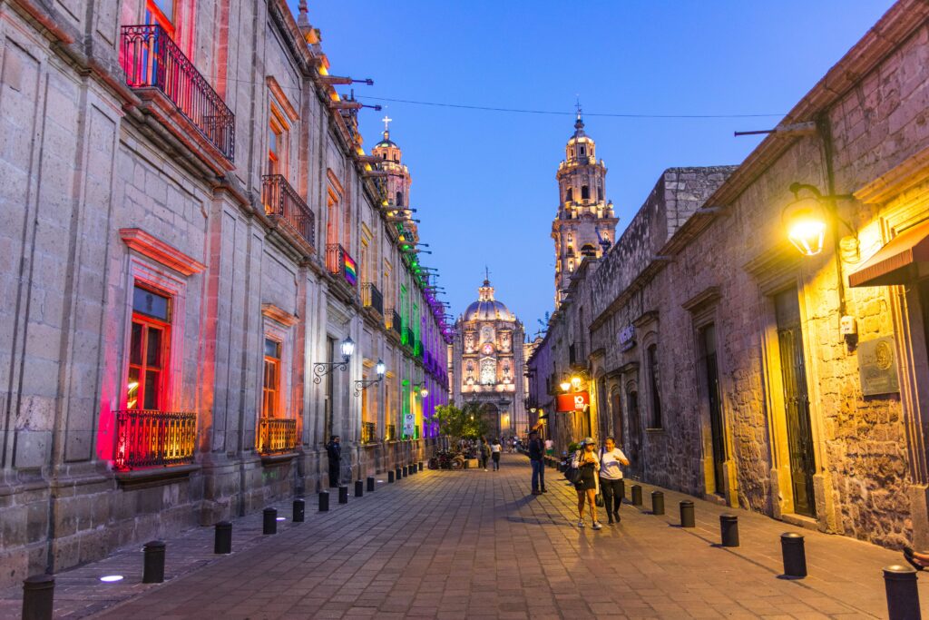 Vibrant street view with illuminated architecture in Morelia, Mexico.