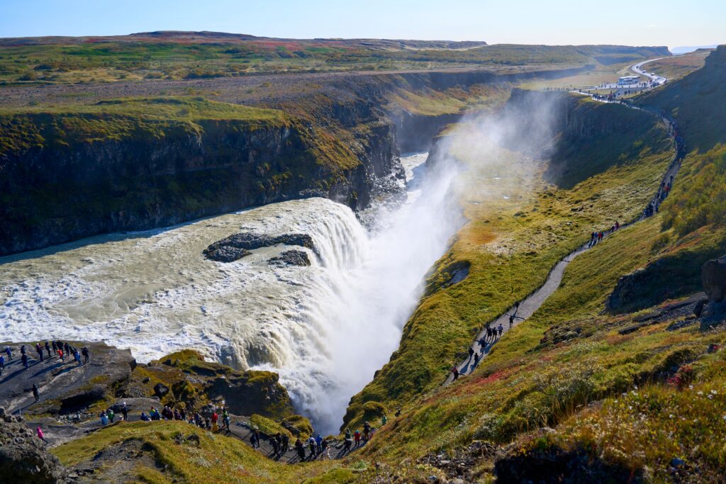 Stunning view of Gullfoss waterfall in Iceland, a popular tourist destination with vibrant landscapes.