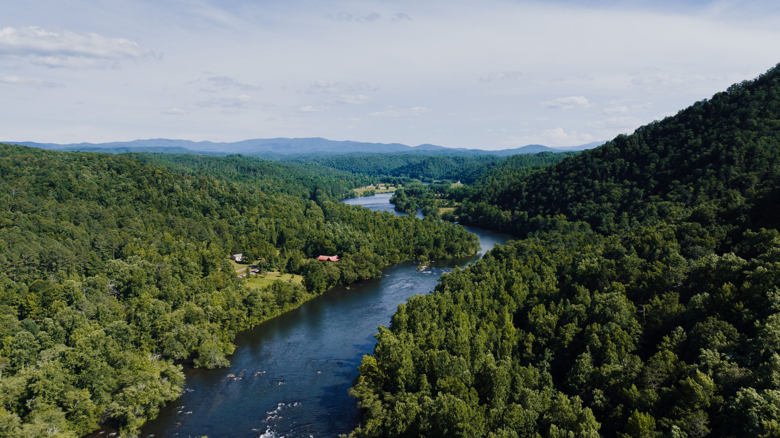 Scenic view of a river winding through the lush hills of Tennessee.