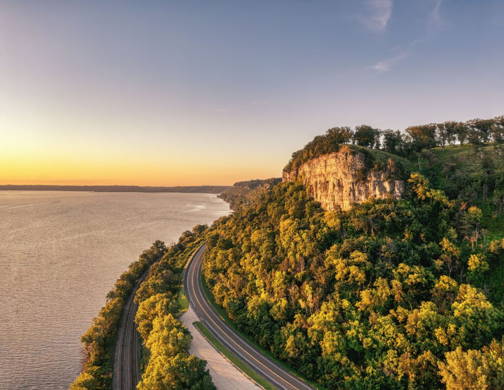 A breathtaking view of Stockholm, Wisconsin's Mississippi River bluffs at sunset, highlighting the natural beauty of the landscape.