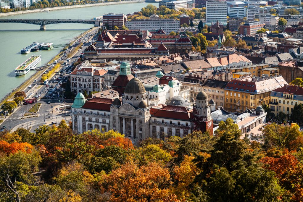 Beautiful autumn colors surround historic architecture in Budapest's cityscape, showcasing cultural heritage.