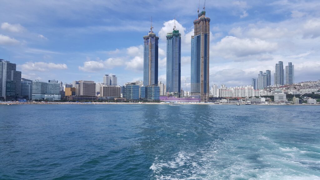 Spectacular view of skyscrapers along the Busan waterfront on a clear day.