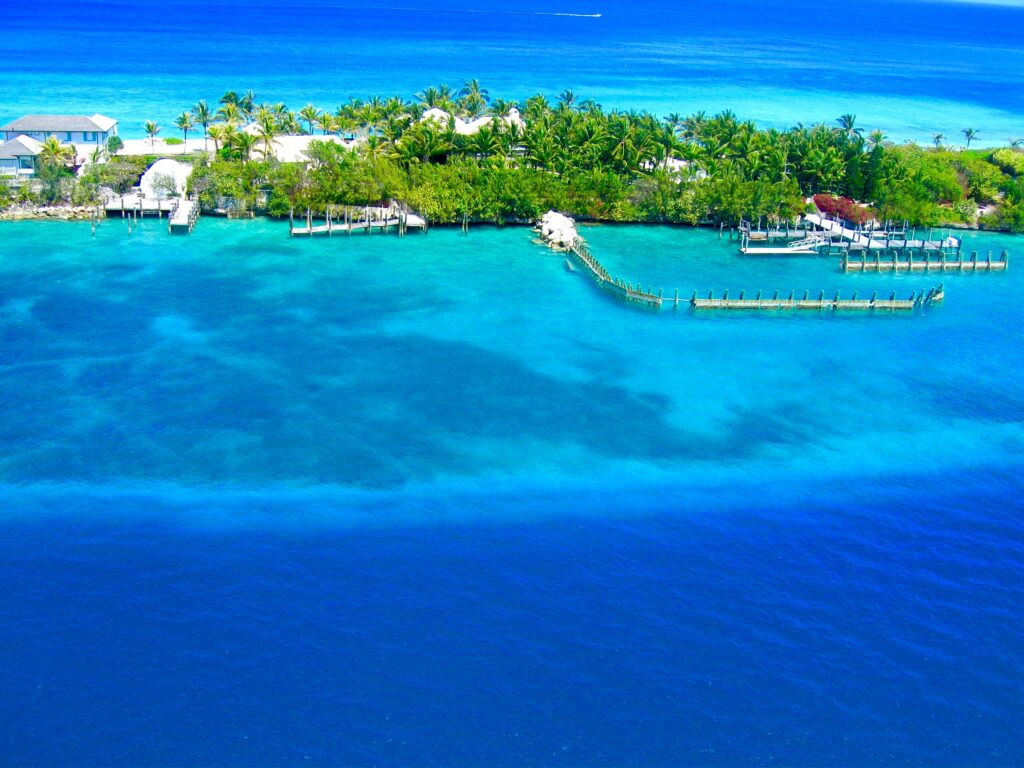 A breathtaking aerial view of Nassau, Bahamas showcasing vibrant blue waters and lush greenery.