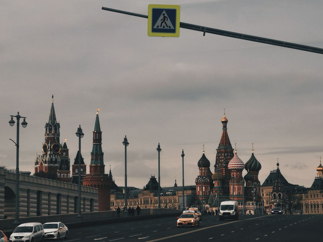Scenic view of iconic landmarks in Moscow, featuring Kremlin towers and St. Basil's Cathedral.