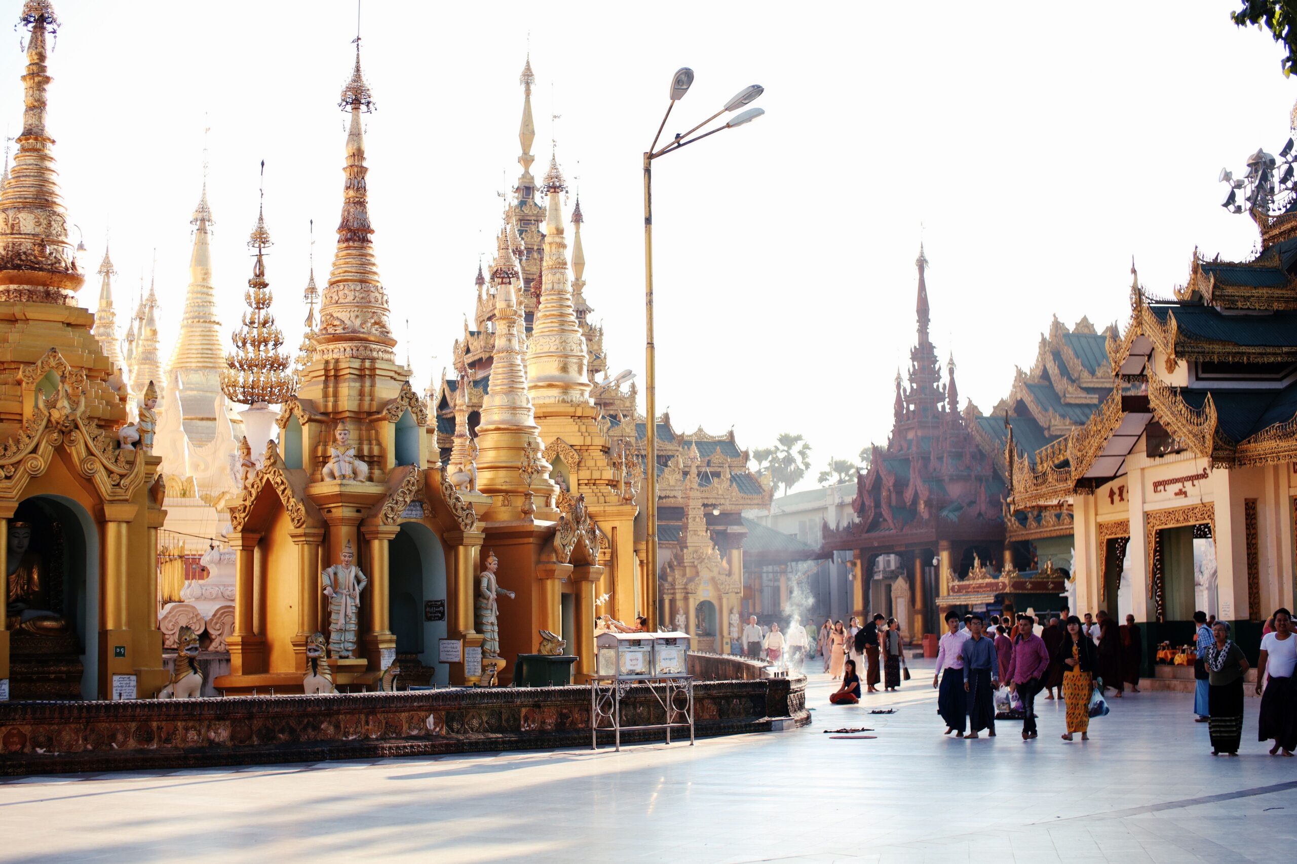 Capture of the iconic Shwedagon Pagoda with visitors, a symbol of Buddhism in Yangon, Myanmar.