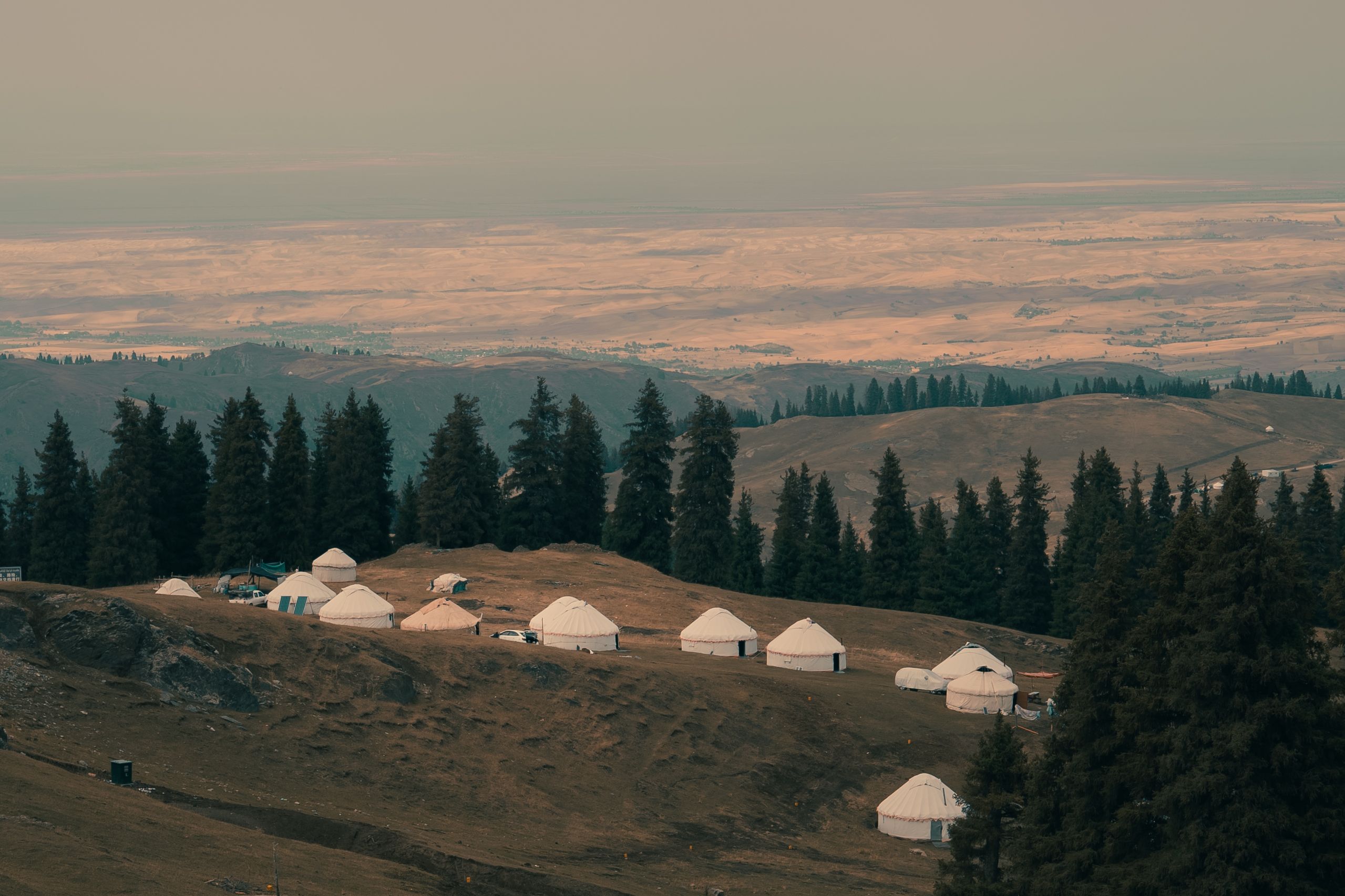 Beautiful landscape of yurts among mountains in Xinjiang, China.