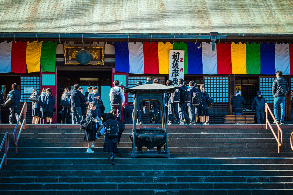 Students visit a colorful temple in Kawagoe, Japan, showcasing cultural exploration and education.