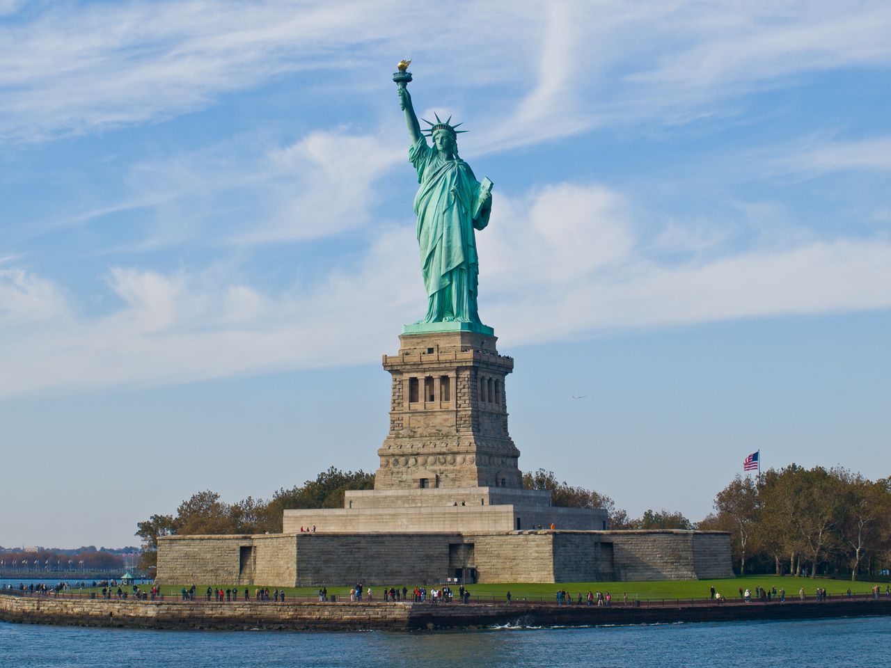 A vibrant image of the Statue of Liberty on a clear day, symbolizing freedom and democracy.