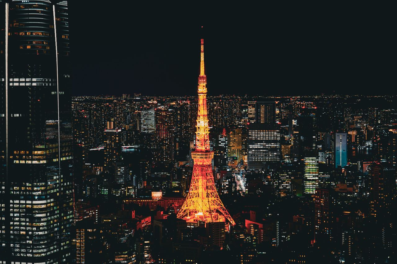 Stunning nighttime view of the Tokyo Tower glowing in the vibrant Tokyo skyline, Japan.