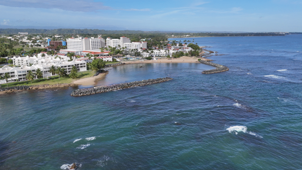 Stunning aerial view of Dorado's beachfront and resorts in Puerto Rico on a sunny day.