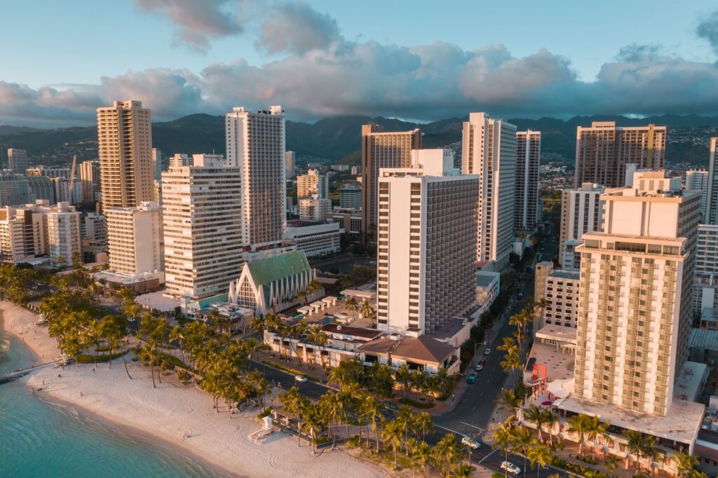 Stunning aerial view of Waikiki's beachfront skyline at sunset in Honolulu, Hawaii.